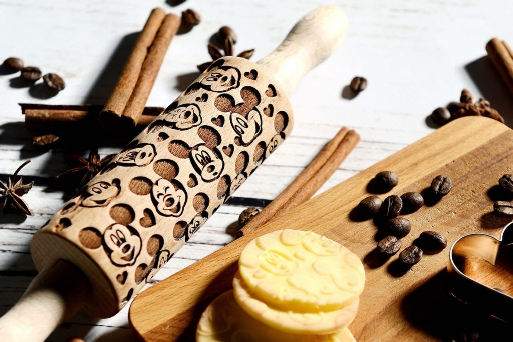 An engraved Disney rolling pin with a Mickey pattern