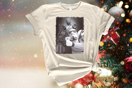 A graphic t-shirt with Darth Vader and an Imperial Stormtrooper taking a selfie with a petrified Han Solo