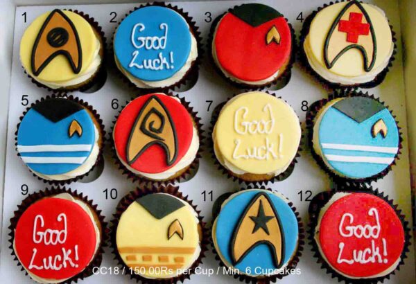12 cupcakes with Star Trek badges and uniforms