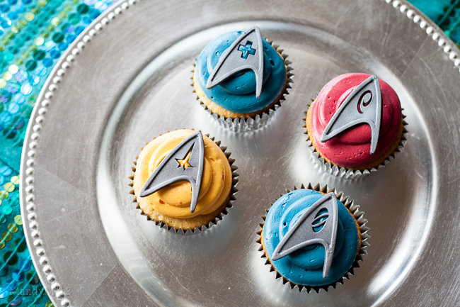 4 cupcakes with Star Trek uniform badges